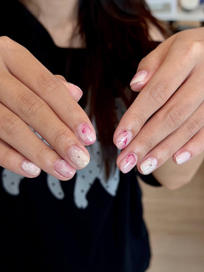 Pink nails with tiny red accents